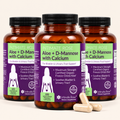 Three amber supplement bottles labeled Intimate Rose Aloe + D-Mannose with Calcium, arranged together with three beige capsules in front on a white background.