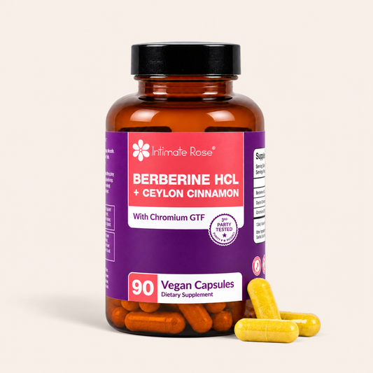 An amber supplement bottle labeled 'Intimate Rose Berberine HCL + Ceylon Cinnamon' with a purple and pink label, shown on a light beige background with several yellow capsules placed in front.