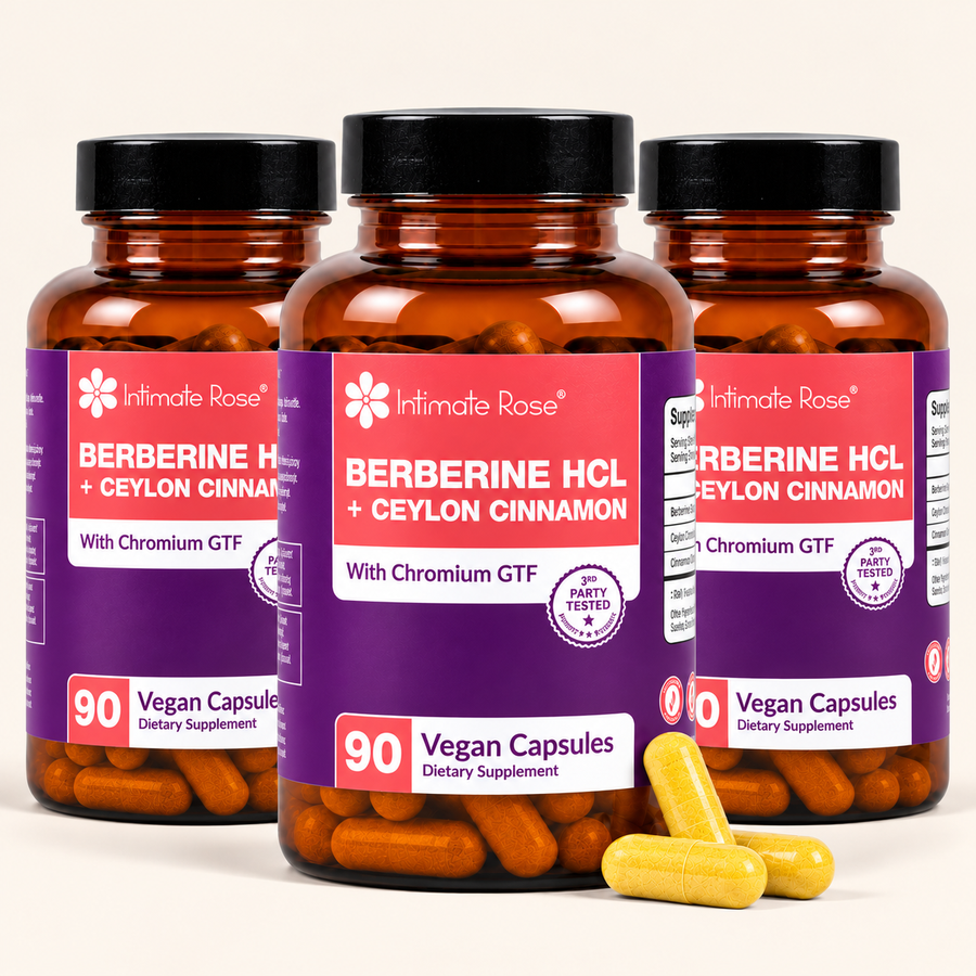Three amber supplement bottles labeled Intimate Rose Berberine HCl + Ceylon Cinnamon, arranged together on a light beige background with three yellow capsules in front.