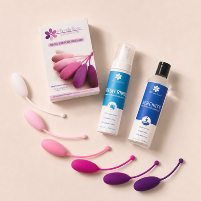 Flat lay of the Intimate Rose Pelvic Floor Strength Bundle with six Kegel weights, Fresh Rinse cleanser, and Serenity lubricant