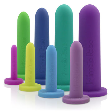 Colorful silicone pelvic dilators of different sizes, standing upright.