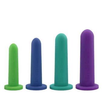 Four differently sized and colored cylindrical silicone objects on a white background.
