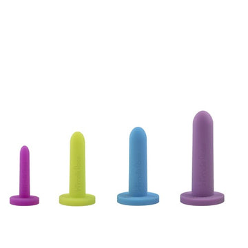 Four colorful cylindrical objects of varying sizes with flat bases on a white background.